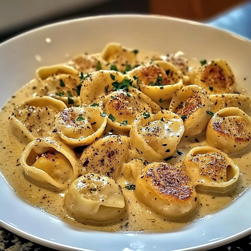 Recipe preparation for Cajun Chicken Tortellini with Creamy Garlic Sauce